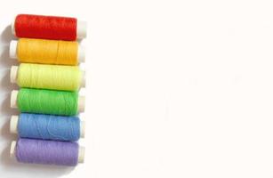 colorful bobbins isolated on white background, rainbow colors photo