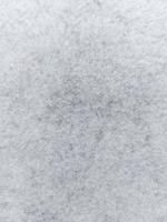 white gray felt fabric texture. winter background. wallpaper photo