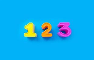 1 2 3 numbers isolated on a blue background. banner, bright toy, learning photo