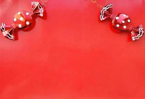 christmas decoration candy polka dots on a red background. banner, horizontal border, frame with place for text. copy space photo