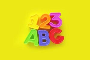 a b c letters and 1 2 3 numbers isolated on yellow background. banner, poster, brightly toy, learning photo