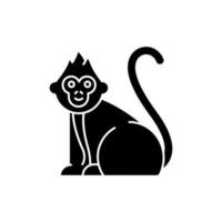 Baby monkey glyph icon. Tropical country animal, mammal. Exploring Indonesian islands wildlife. Cute primate sitting. Silhouette symbol. Negative space. Vector isolated illustration
