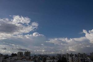 Air clouds in the blue sky photo