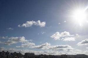 Air clouds in the blue sky photo