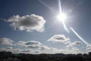 Air clouds in the blue sky photo