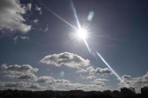 Air clouds in the blue sky photo