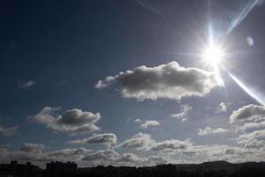 Air clouds in the blue sky photo