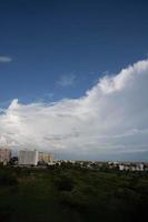 Air clouds in the blue sky photo