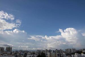 Air clouds in the blue sky photo