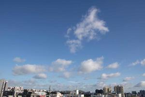 Air clouds in the blue sky photo