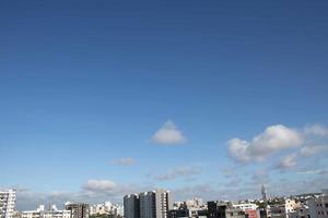 Air clouds in the blue sky photo