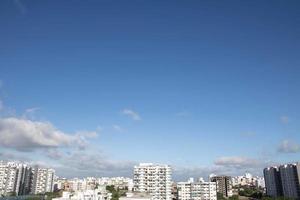 Air clouds in the blue sky photo