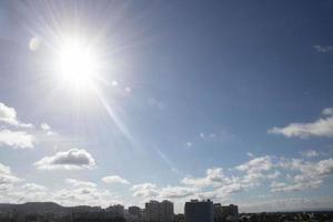 Air clouds in the blue sky photo