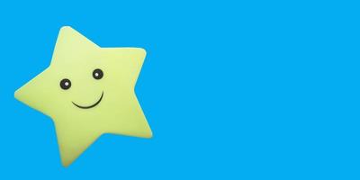 star toy with a smile on a blue background with place for text, copy space. fun kids banner, dream, night. photo