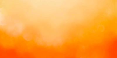 abstract orange backgroundand summer background with light bokeh photo