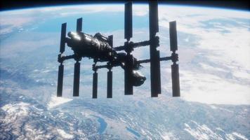 A view of the Earth and a spaceship. ISS is orbiting the Earth video