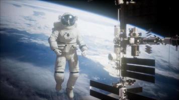 International Space Station and astronaut in outer space over the planet Earth video