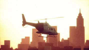 Silhouette helicopter at city scape background video