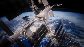 A view of the Earth and a spaceship. ISS is orbiting the Earth video