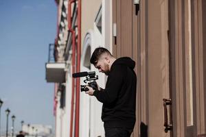 operator with a camera shoots a report photo