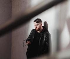 handsome hipster man model with stylish sunglasses photo