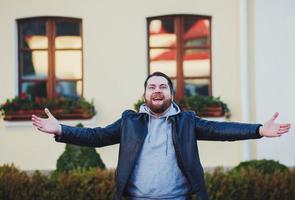 Portrait of fascinated excited young guy photo