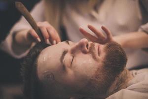 bearded man in barbershop photo