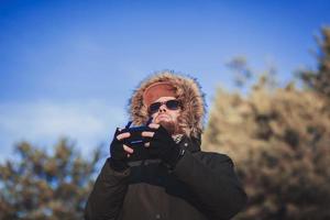 man in sunglasses with a remote control photo