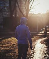 man in hood with a drone photo