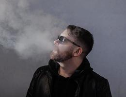 trendy bearded man smoke photo