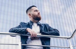 young bearded man in looking away photo