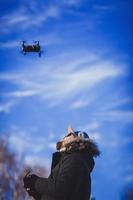 man playing with the drone photo