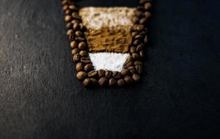 coffee beans from which the latte mug is made photo