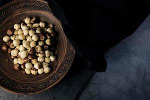 Hazelnuts on a round plate photo