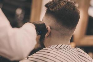 guy sitting in barbershop photo