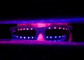 man in neon sunglasses photo