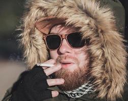 close-up of a man with a cigarette photo