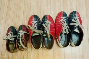 Three pairs of shoes for bowling photo