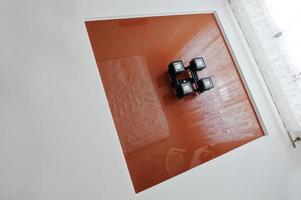 Brown stretched ceiling with lamp at the interior of room photo