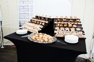Reception with baking  at black table photo