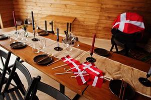 Denmark flags on table. Travel to Scandinavian countries. photo