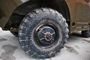 Close up wheel on armored military car. photo