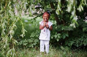 Amazing beautiful african american baby girl with sunglasses having fun photo