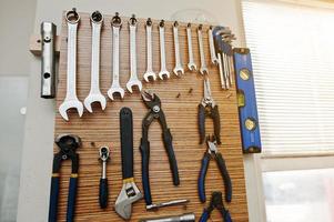 Group of used tools on wood deck, toolkit photo