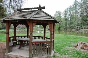 Wooden garden house pavilion at park photo