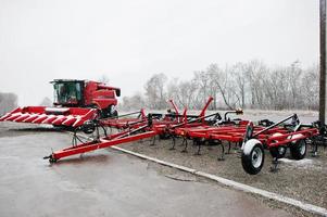 New red combine with harvester reaper and seeder photo