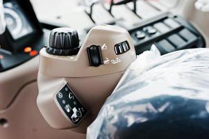 Controls panel in the cabin of the new tractor photo