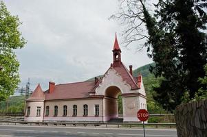 Train stop on mountains way near road photo