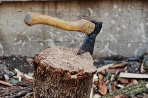 Axe in stump background chopped firewood. photo