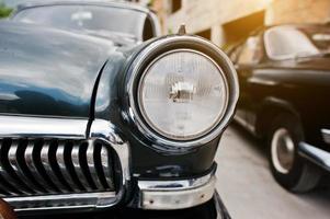 Old vintage car headlight close up. photo